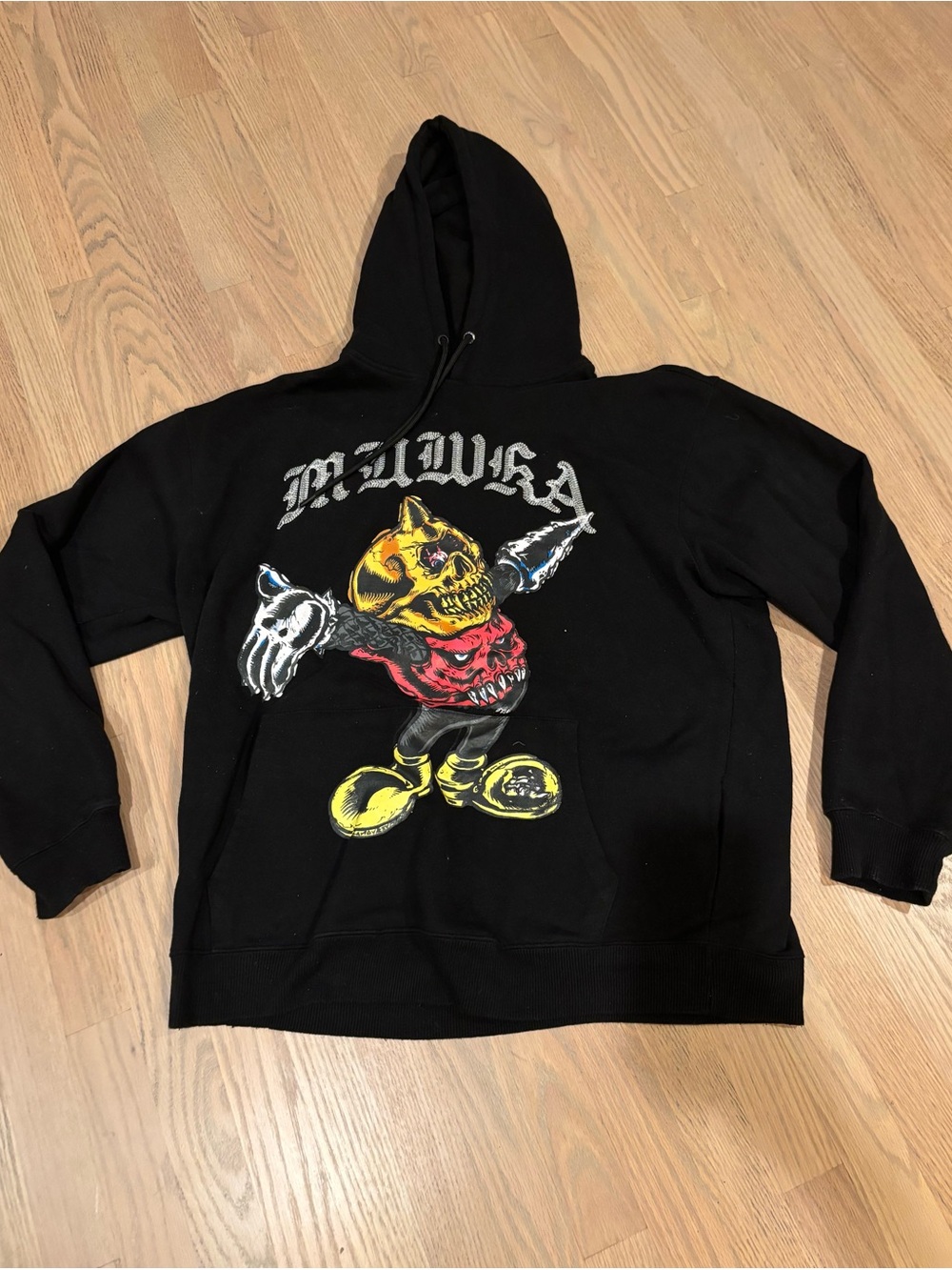 Mishka Black Hoodie with Yellow & Red Graphic Skull Character